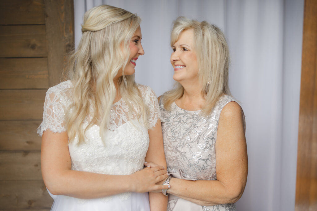 Taylor sharing a sweet moment with her mom on her wedding day