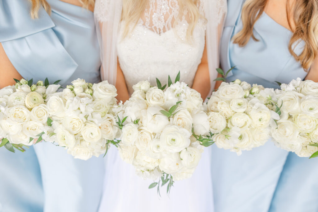 Blue and white bridal bouquet with bridesmaids at Park Crest