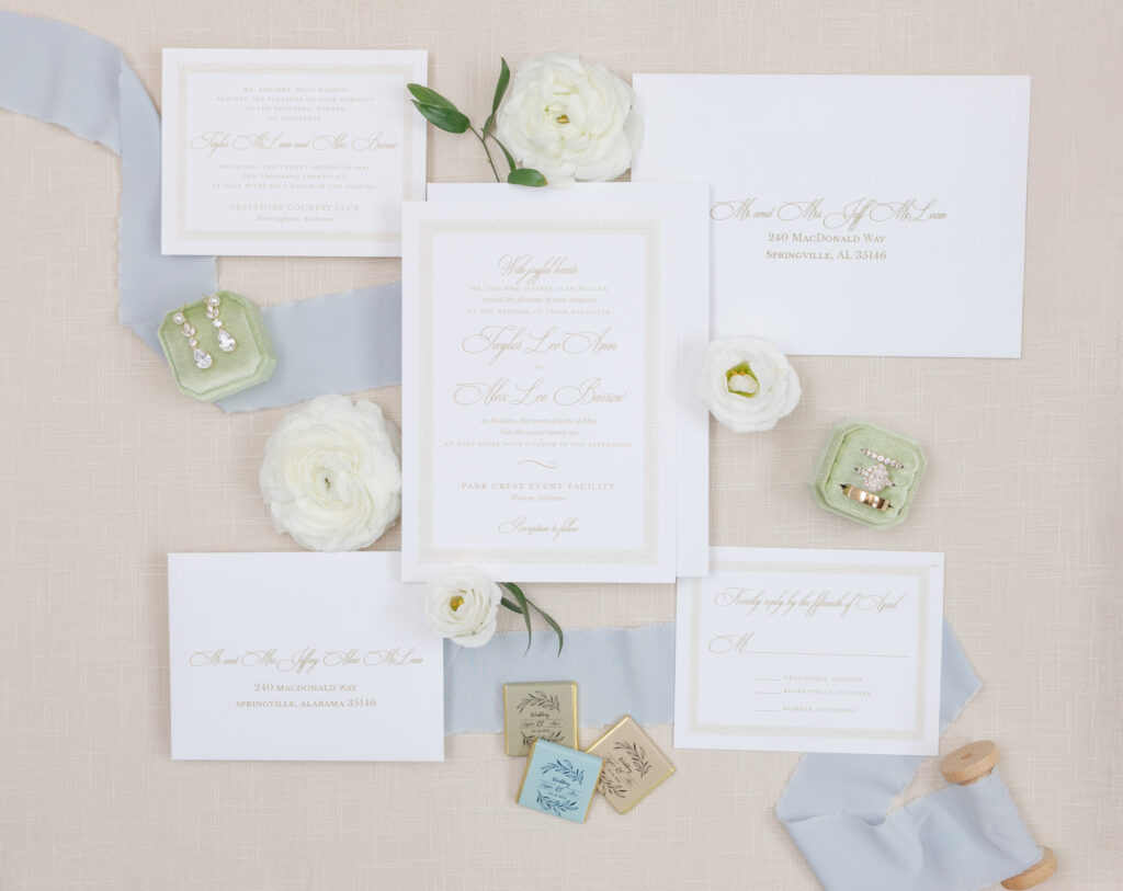 Blue and white wedding invitation suite with floral details