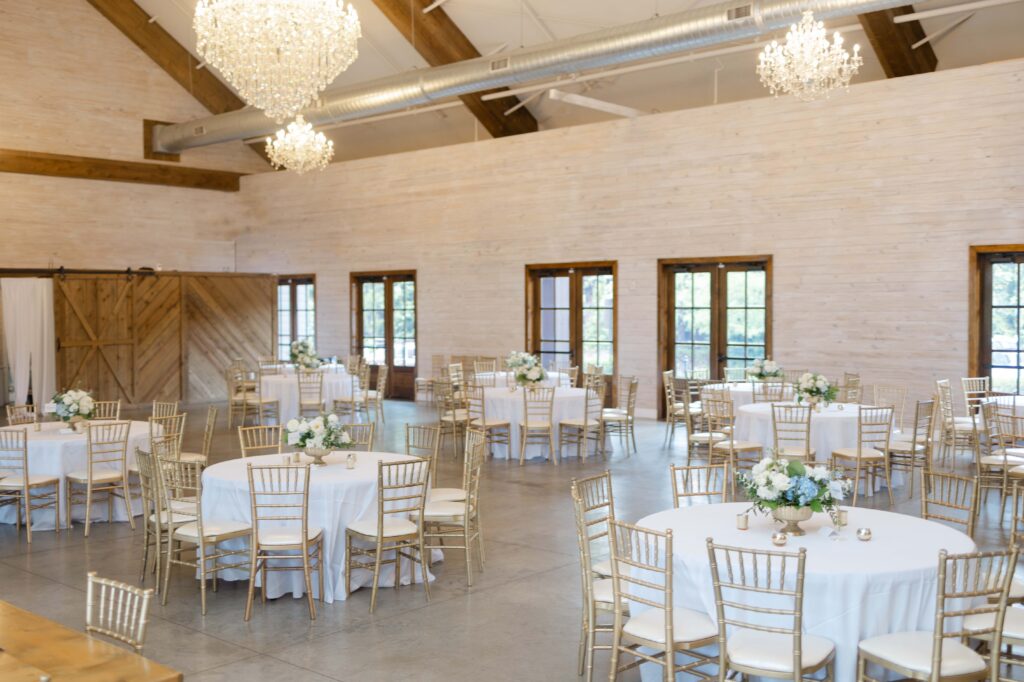 Wedding reception space decorated with blue and white details at Park Crest Event Facility