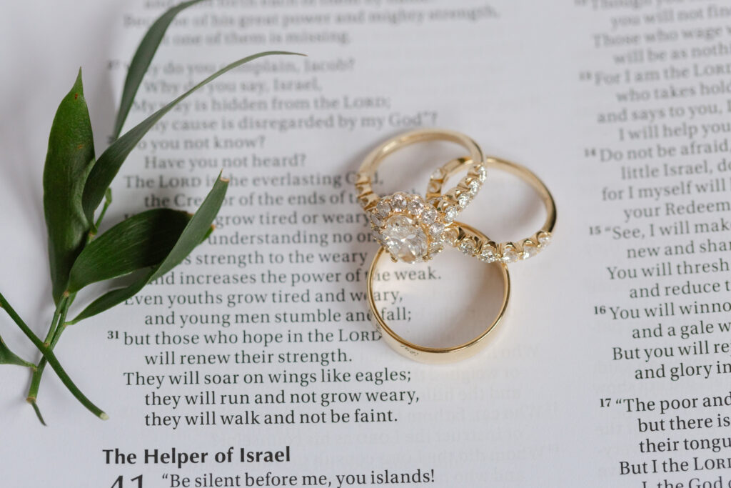 Wedding rings resting on a Bible before a Park Crest wedding