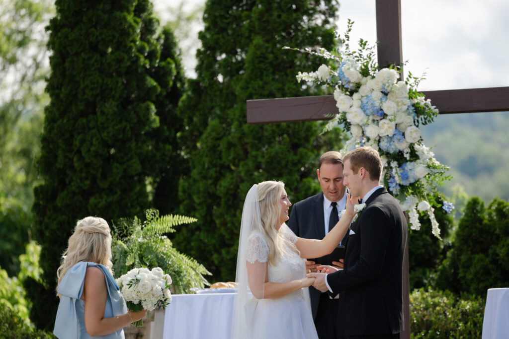 Taylor and Alex laughing together during wedding portraits