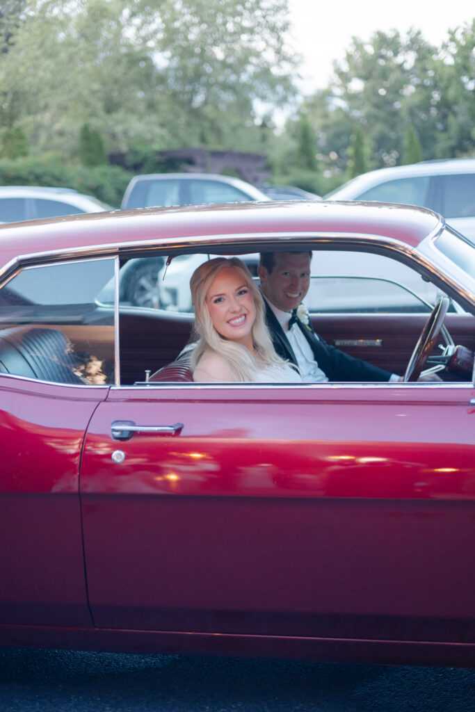 Alex’s red car waiting as the couple’s wedding getaway car
