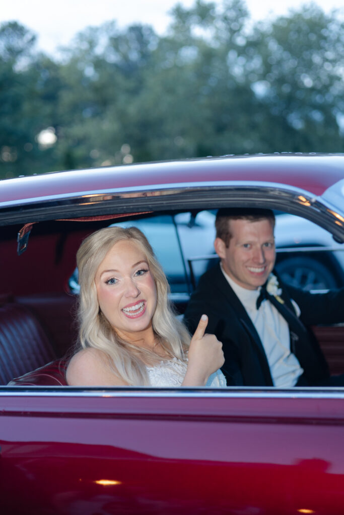 Taylor and Alex in a red get away car.