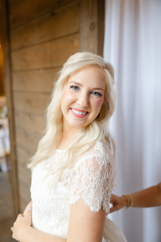 Taylor getting into her wedding gown before the ceremony
