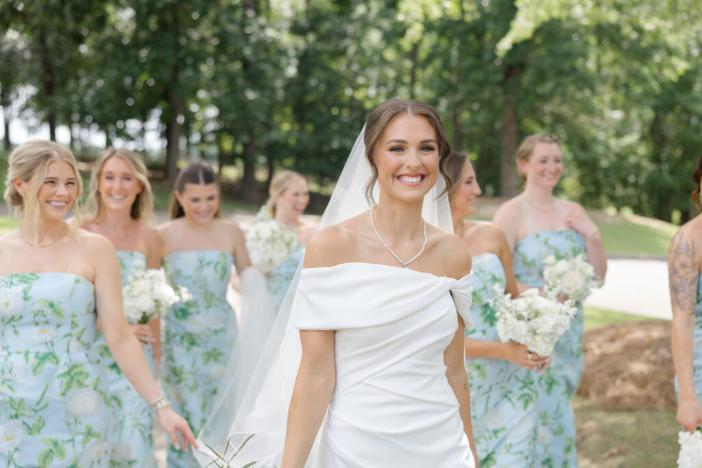 Brooke laughing during bridal party portraits on her wedding day
