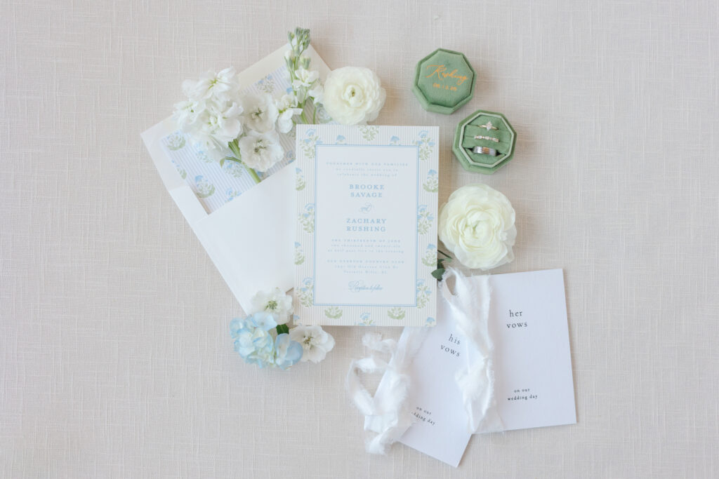Blue and green wedding invitation suite with white florals at Old Overton Country Club