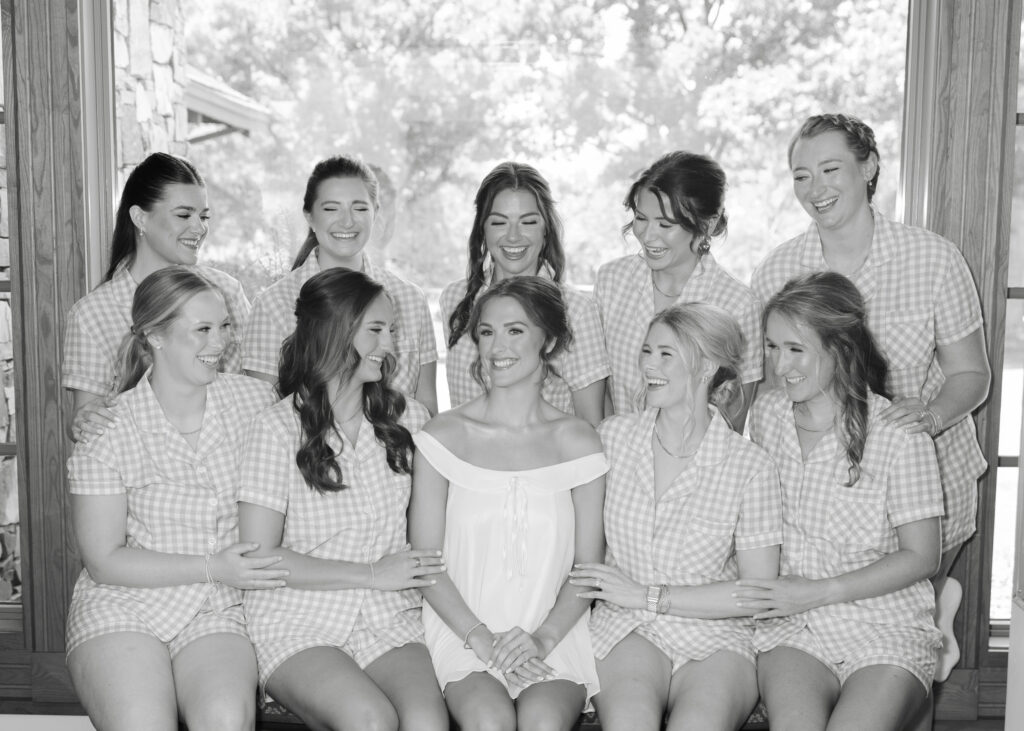Black and white photograph of Brooke getting ready for her wedding
