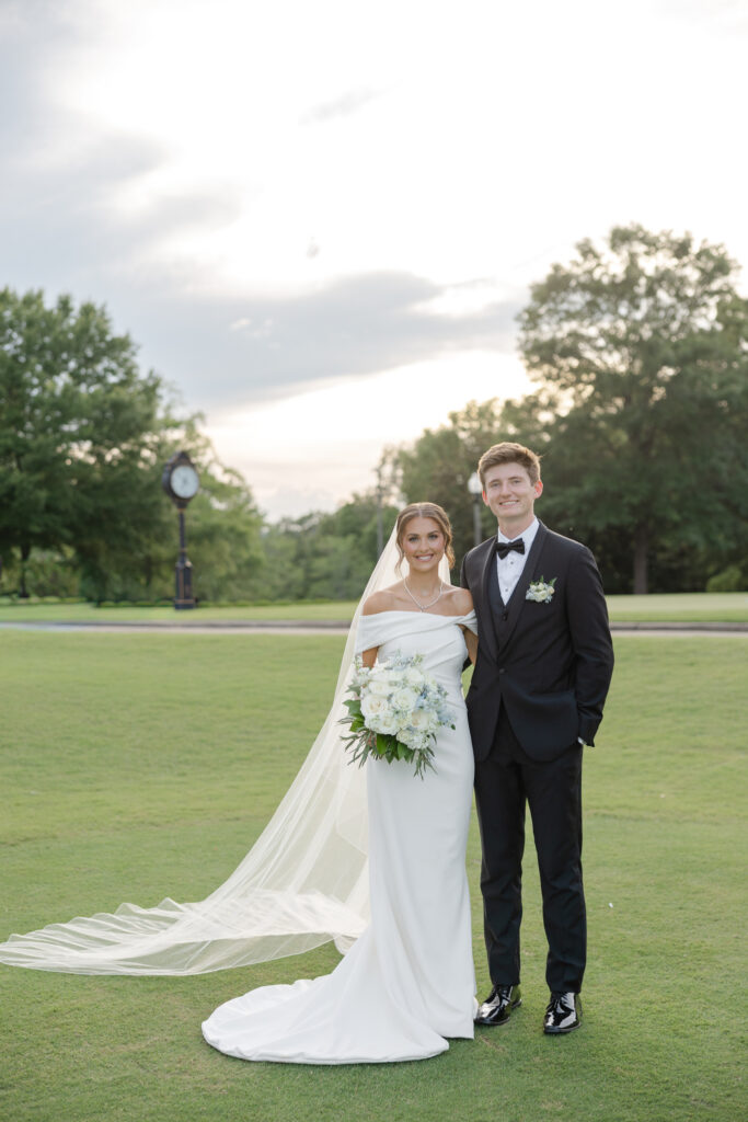 Full-length wedding portrait of Brooke and Zach at Old Overton Country Club