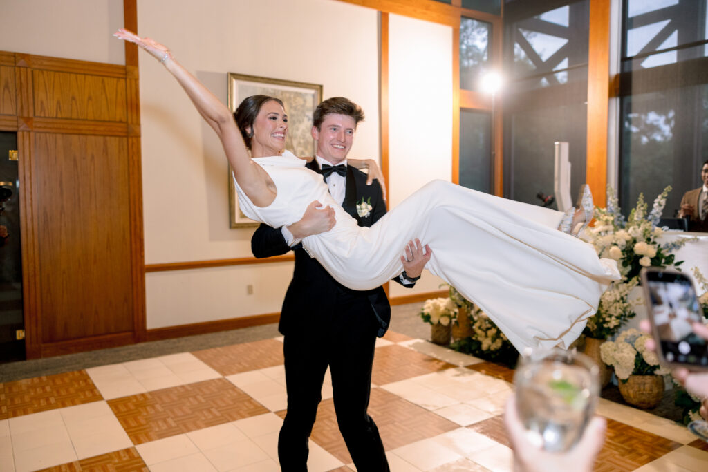 Zach picking Brooke up during their first dance
