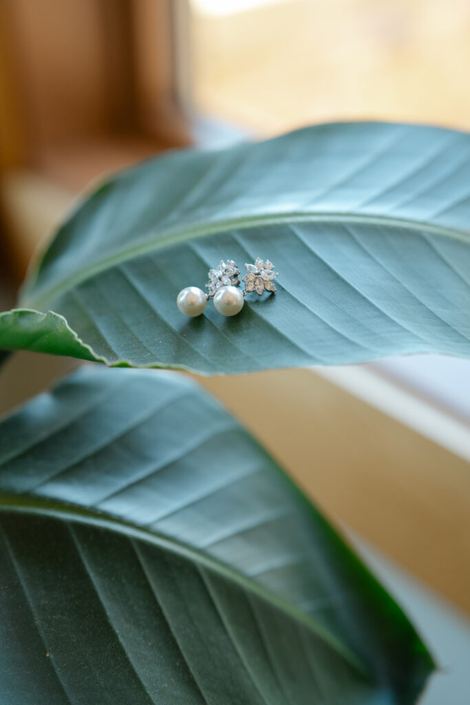 Pearl bridal earrings on leaf