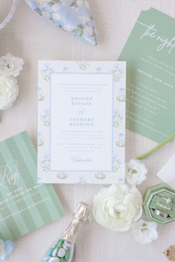 Blue and green wedding invitation suite with white florals at Old Overton Country Club