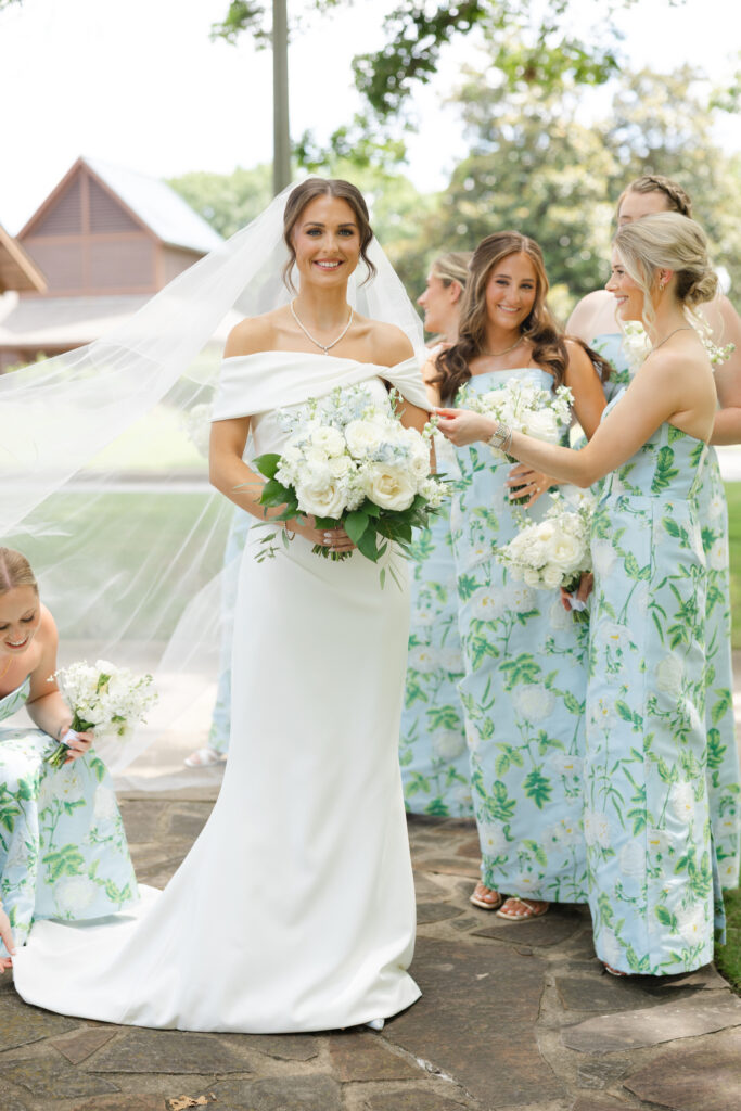 Brooke laughing with her bridesmaids before the wedding ceremony