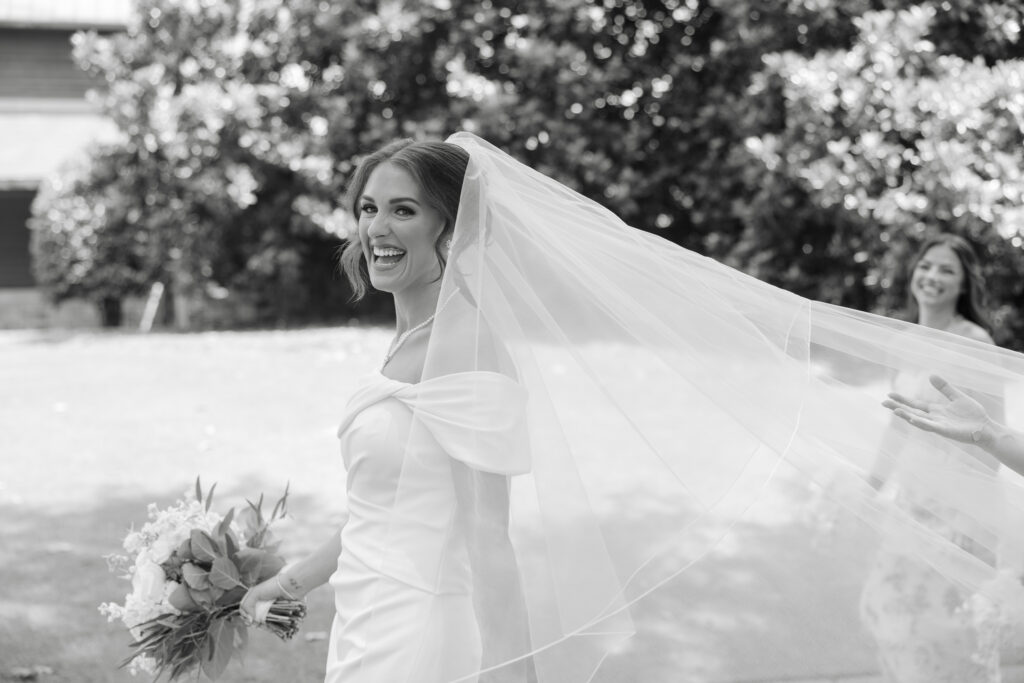 Brooke wearing her long wedding veil at Old Overton Country Club